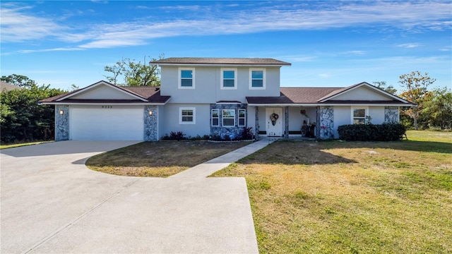 view of front property with a front yard and a garage