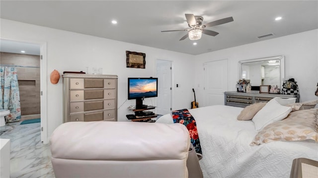 bedroom with ensuite bathroom and ceiling fan