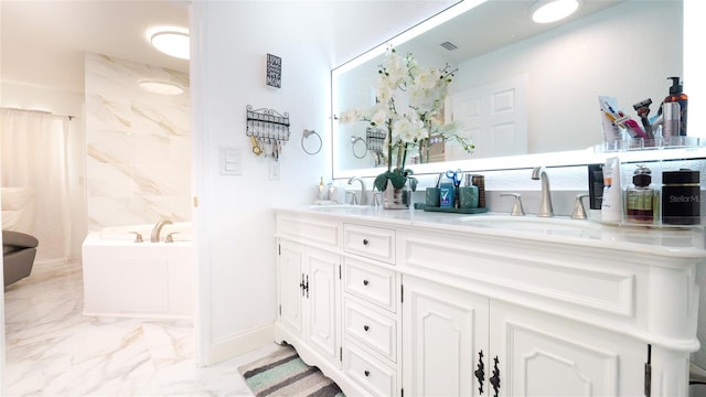 bathroom featuring a bathtub and vanity