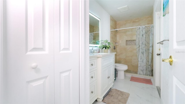 bathroom featuring vanity, toilet, and walk in shower