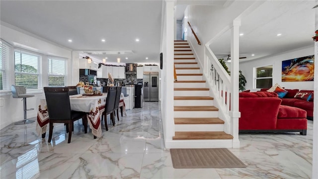 dining space with ornamental molding