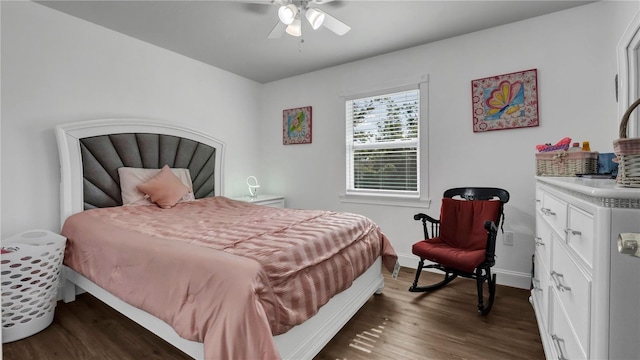 bedroom featuring ceiling fan and dark wood-type flooring