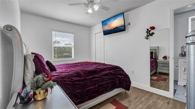 bedroom with hardwood / wood-style floors and ceiling fan