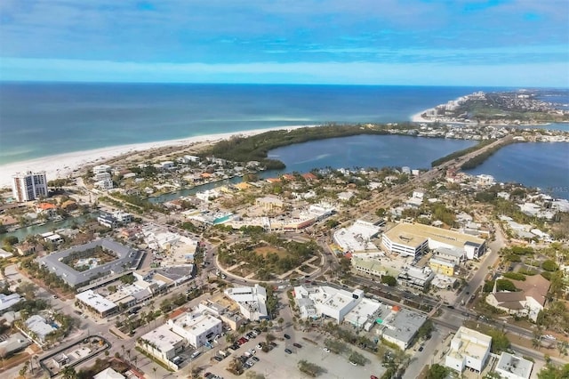 aerial view with a water view and a view of the beach