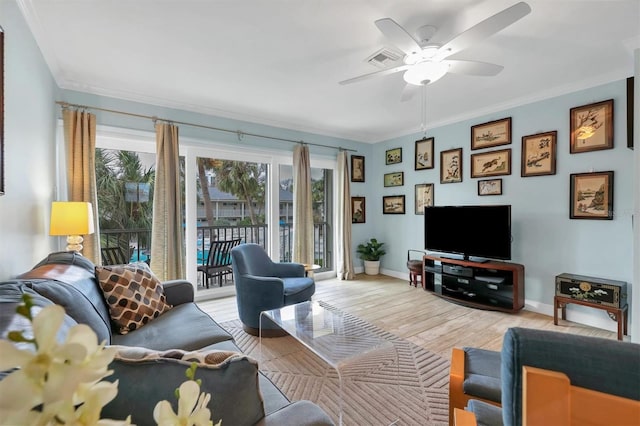 living room with ceiling fan, light hardwood / wood-style floors, and ornamental molding