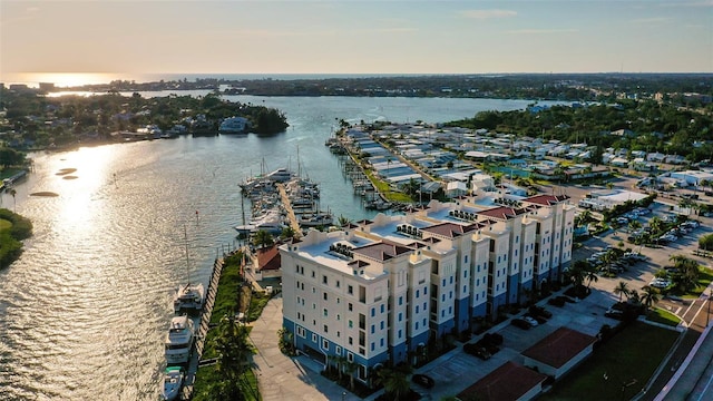 aerial view at dusk with a water view