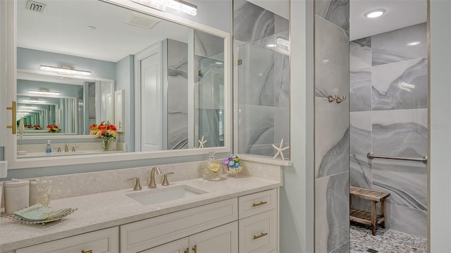 bathroom featuring vanity and walk in shower