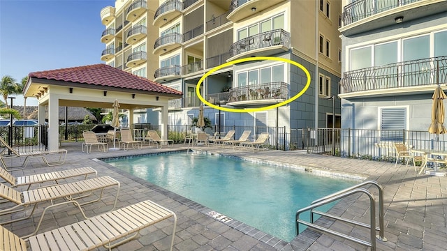 view of swimming pool with a gazebo and a patio