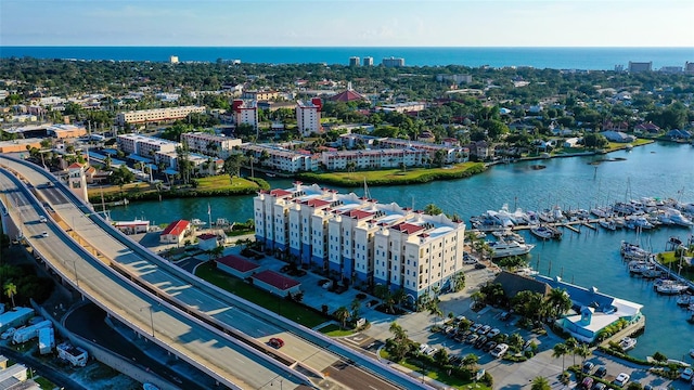 birds eye view of property with a water view