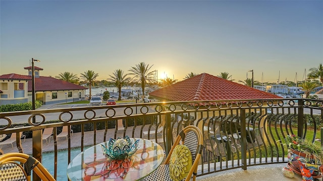 view of balcony at dusk