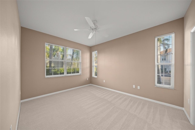 carpeted empty room with ceiling fan