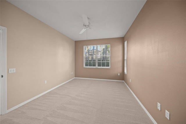 unfurnished room featuring ceiling fan and light colored carpet