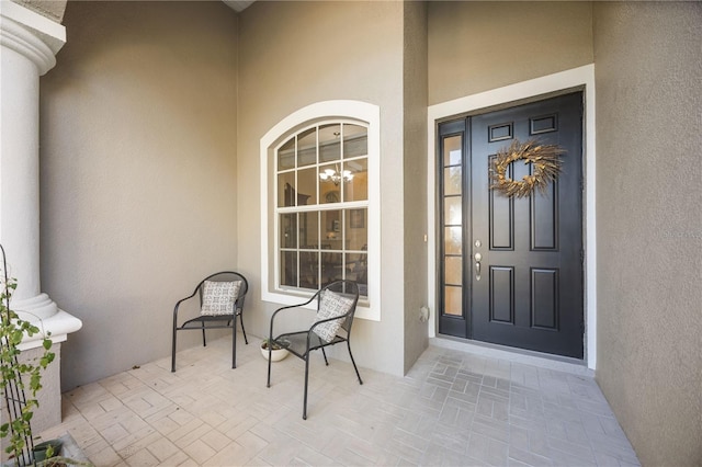 doorway to property with a porch