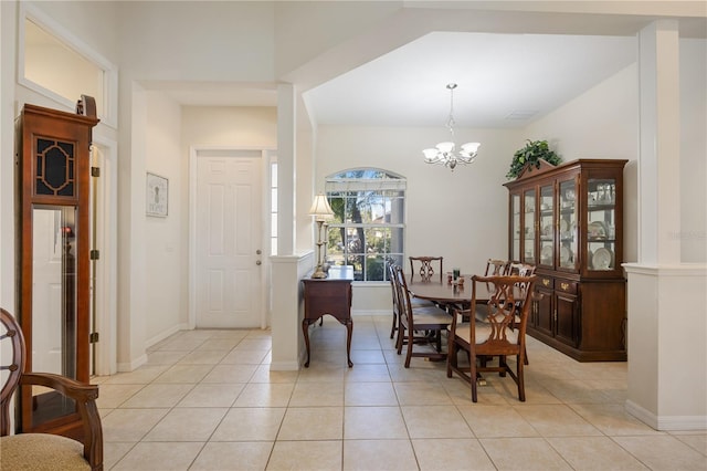 dining space with a chandelier and light tile patterned floors