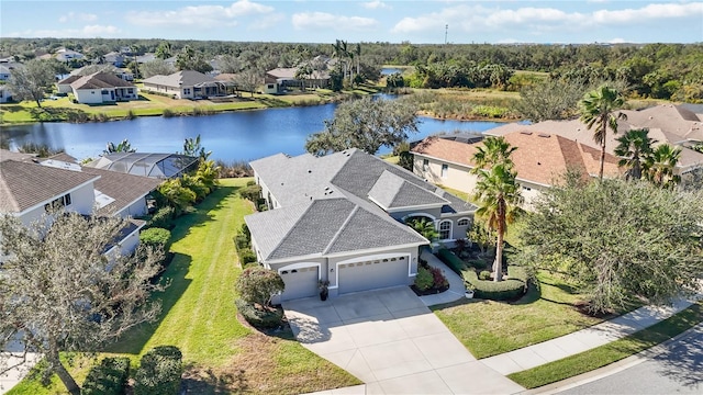 bird's eye view featuring a residential view and a water view