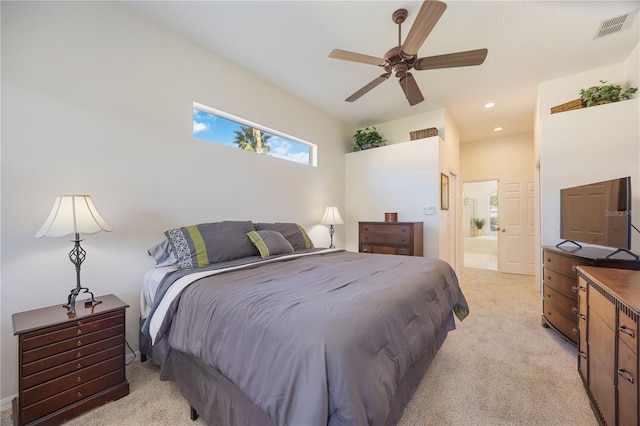 bedroom featuring visible vents, a ceiling fan, ensuite bath, recessed lighting, and light colored carpet
