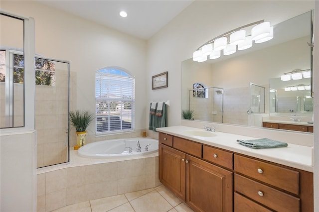 full bathroom with tile patterned flooring, a garden tub, vanity, and a tile shower
