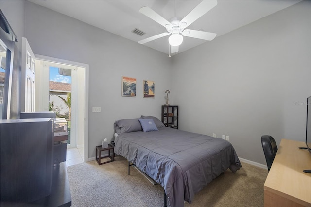bedroom with visible vents, light carpet, baseboards, and ceiling fan