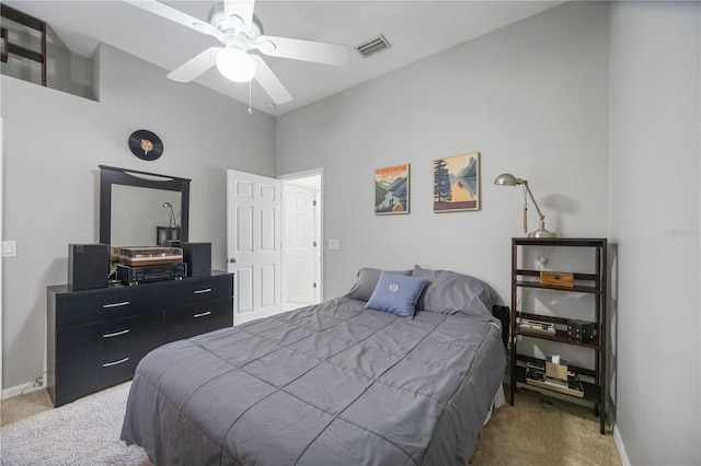 carpeted bedroom with baseboards, visible vents, and ceiling fan