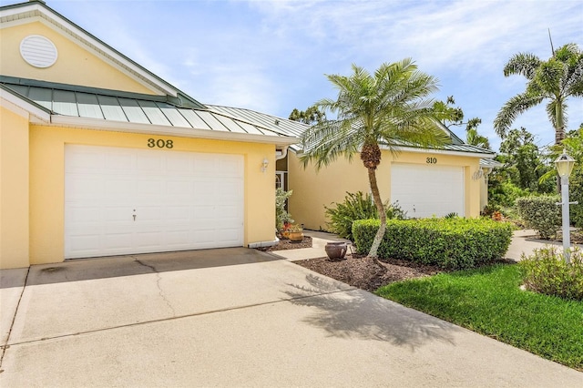 view of front of home with a garage