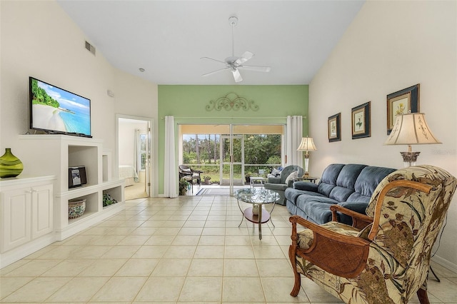 tiled living room with built in shelves and ceiling fan