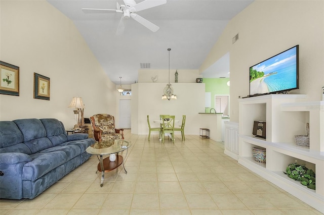 tiled living room with ceiling fan, high vaulted ceiling, and built in features