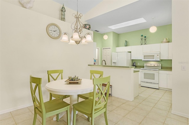 dining room with high vaulted ceiling, light tile patterned floors, a skylight, and a notable chandelier