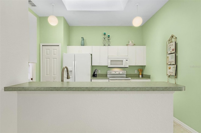 kitchen featuring decorative light fixtures, white appliances, kitchen peninsula, and white cabinets