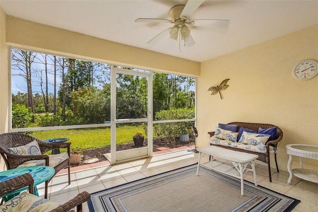 sunroom featuring ceiling fan