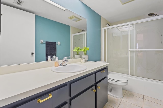 bathroom with tile patterned flooring, visible vents, shower / bath combination with glass door, and toilet