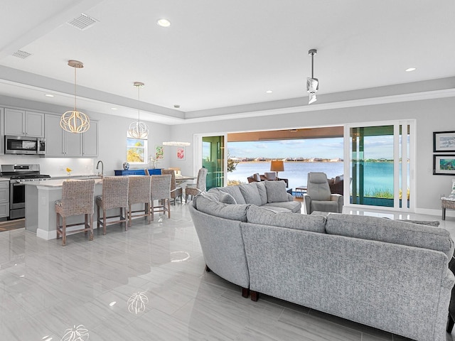 living room with a tray ceiling