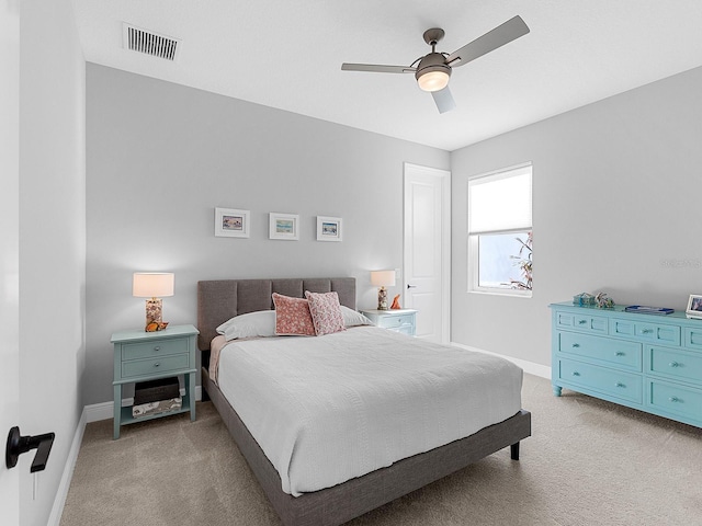 bedroom featuring light carpet and ceiling fan