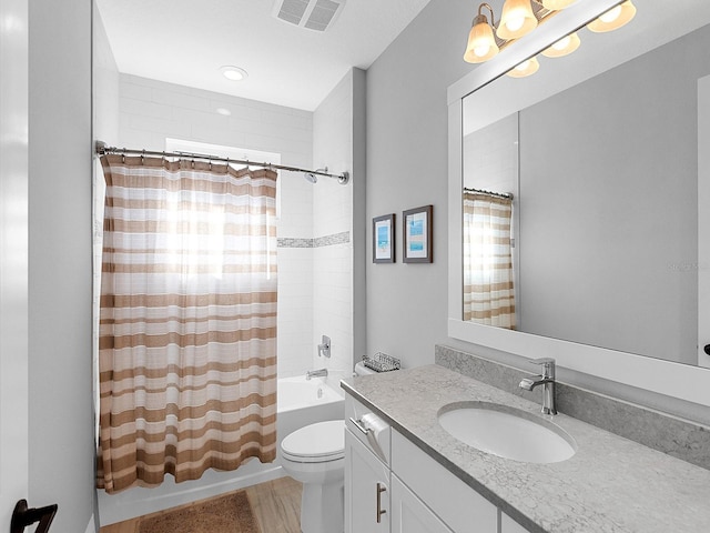 full bathroom featuring vanity, toilet, and shower / bath combo with shower curtain