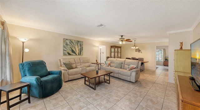 tiled living room featuring a textured ceiling, ceiling fan, and crown molding