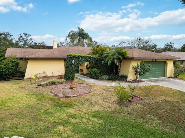 ranch-style home featuring a front lawn and a garage