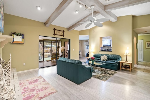 living room with track lighting, ceiling fan, beam ceiling, high vaulted ceiling, and light hardwood / wood-style flooring