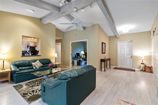 living room with lofted ceiling with beams, ceiling fan, track lighting, and light hardwood / wood-style flooring