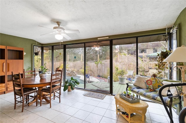 sunroom / solarium with plenty of natural light and ceiling fan