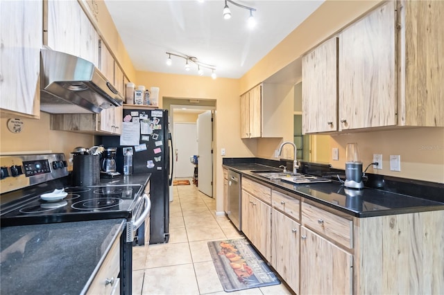 kitchen featuring light brown cabinetry, light tile patterned flooring, and appliances with stainless steel finishes