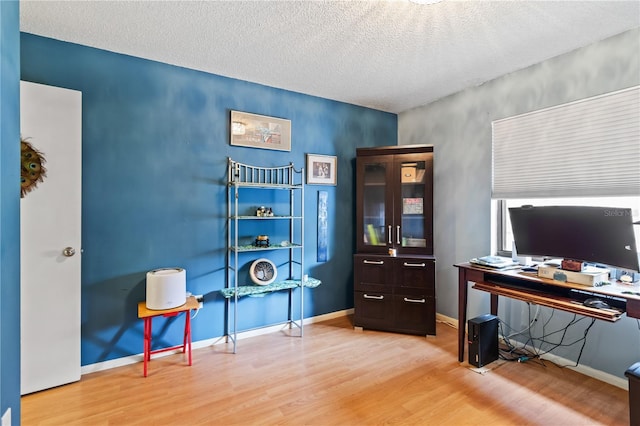 office space featuring hardwood / wood-style floors and a textured ceiling