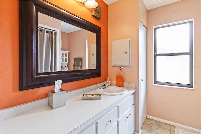 bathroom with tile patterned flooring and vanity