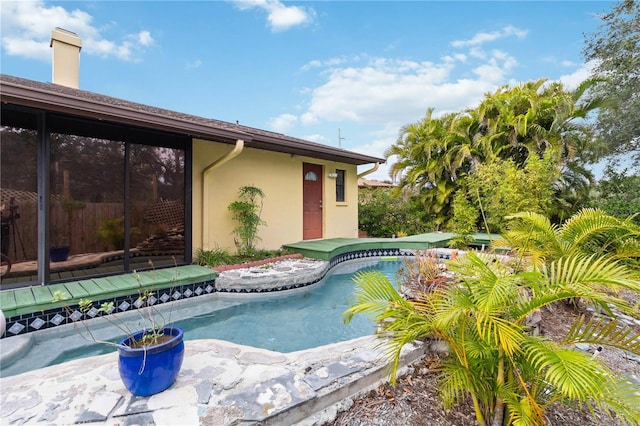 view of pool featuring a jacuzzi