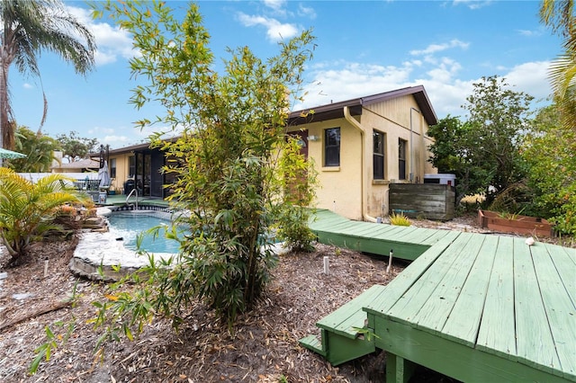 exterior space featuring a swimming pool side deck