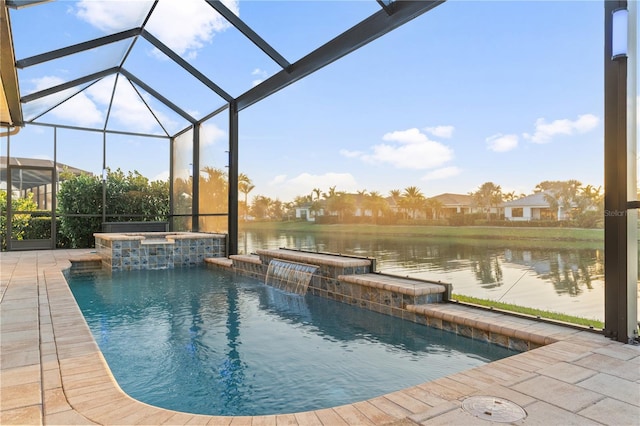 view of pool featuring an in ground hot tub, a water view, a lanai, and a patio