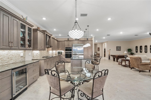 dining room featuring billiards, ornamental molding, and beverage cooler