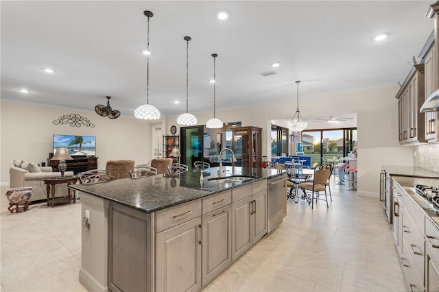 kitchen featuring ornamental molding, dishwasher, pendant lighting, dark stone counters, and a large island