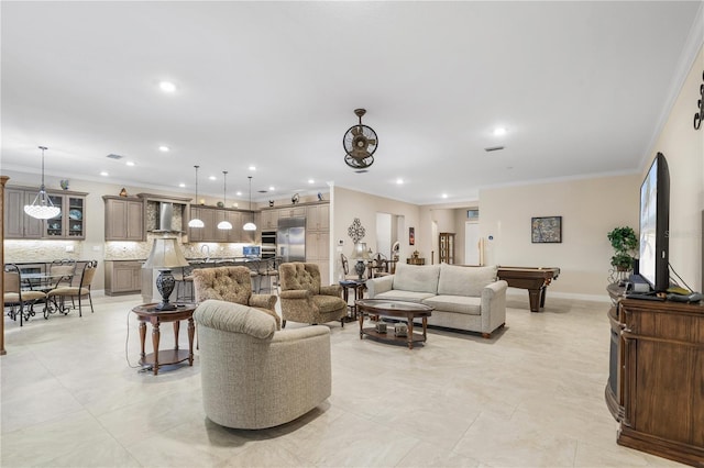 living room with crown molding and billiards