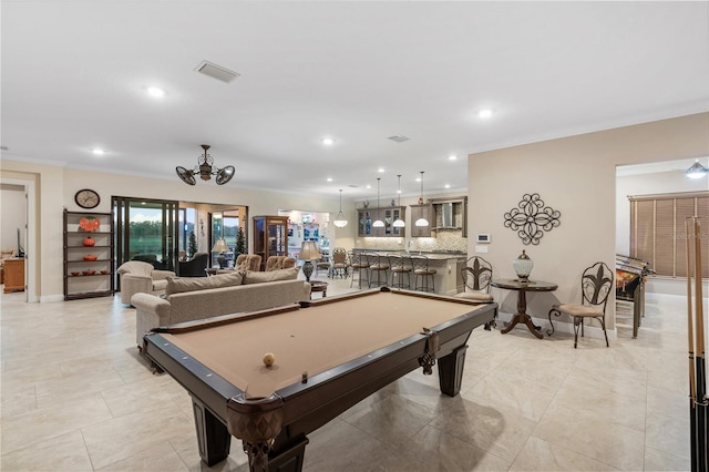 game room with indoor bar, ornamental molding, and billiards