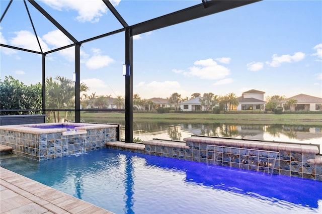 view of pool featuring a lanai, a water view, pool water feature, and an in ground hot tub