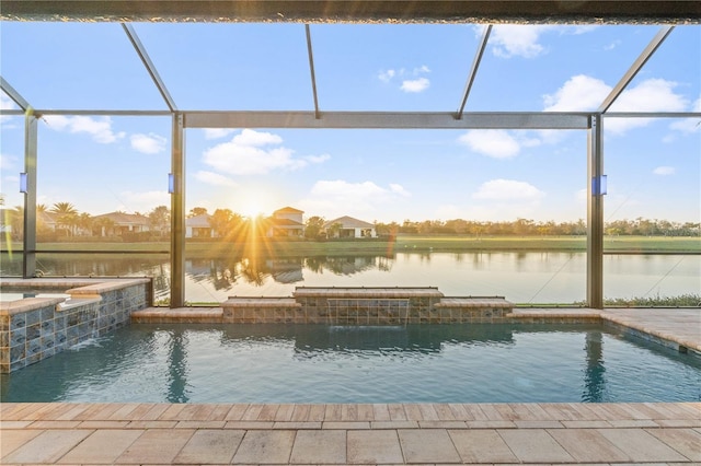 view of swimming pool with pool water feature, a water view, an in ground hot tub, and glass enclosure